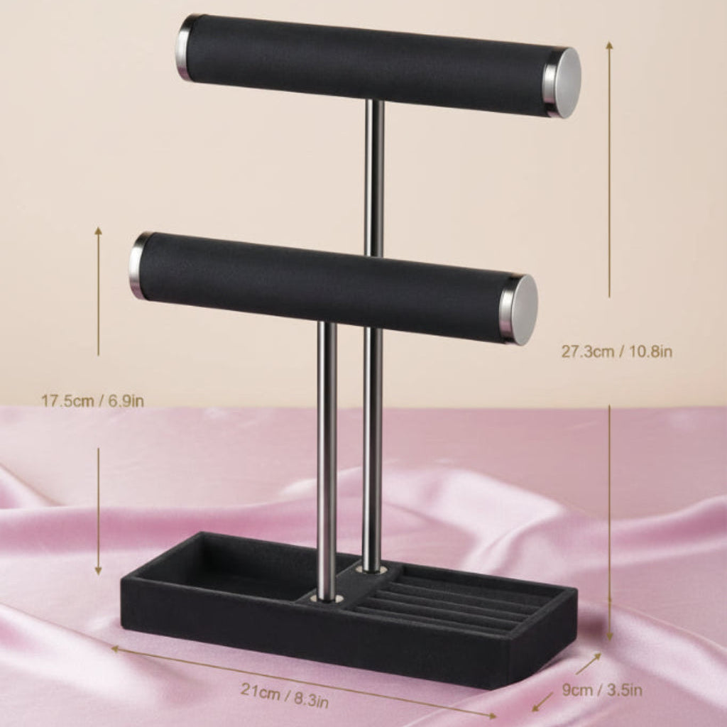 Black 2‑tier velvet jewelry display stand shown on a satin surface with labeled dimensions for height, width, and base depth.
